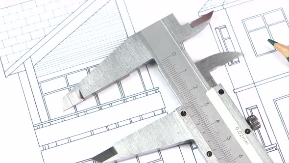 Calliper and Pencils on the Building Plan, Scheme, Rotation, Close Up alt