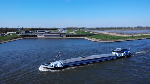 Inland Barge Vessel With Cover Cruising At Noord River Near Hendrik-Ido-Ambacht, Netherlands. - aeri alt