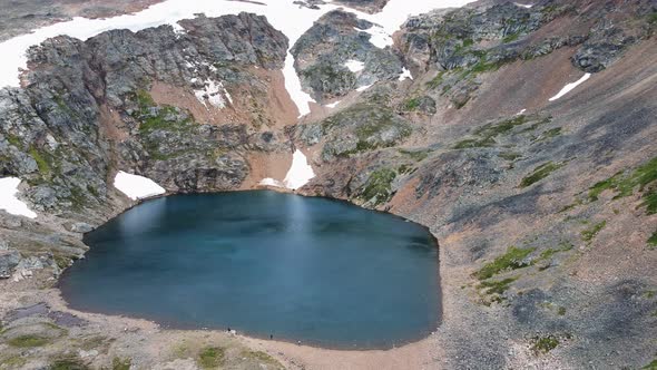 Beautiful, deep blue Crater Lake near the British Columbia town of Smithers, Canada. Aerial parallax alt