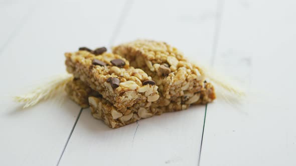 Granola Bars with Dried Fruits Wooden Background alt