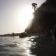 Boy Jumping from a Rock in the Beach - VideoHive Item for Sale