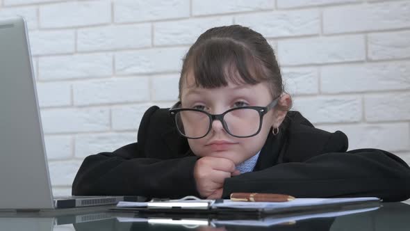 Pensive business child.  alt