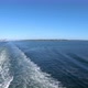 Distant view of Seattle city coastline panorama, leaving town in boat
