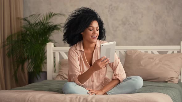 Portrait Cute African American Woman Talking on Video Call Using Digital Tablet alt