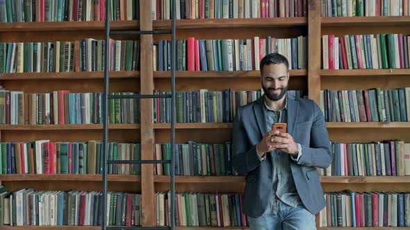 Stylish Young Man In The Library alt
