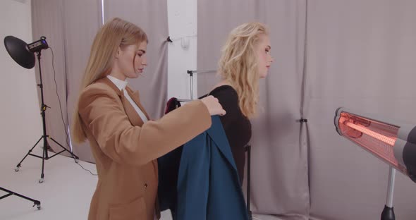 Stylist Creates A New Image For The Model In The Studio