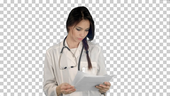 Young female doctor reading patient medical, Alpha Channel
