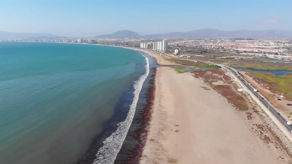 Beach, Road, pacific ocean, coast (Coquimbo, Chile) aerial view, drone footage alt