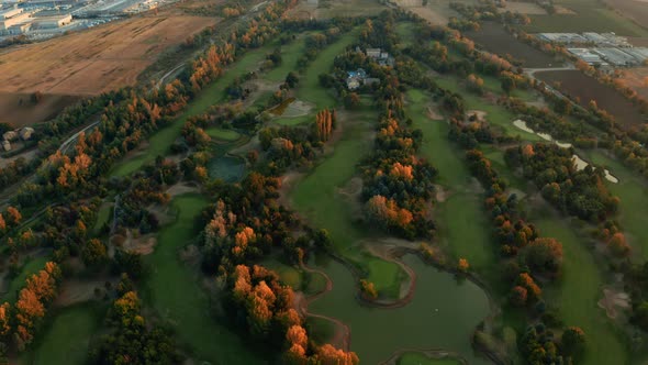 Aerial view of autumn color trees. Golf Course. alt