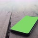 Smart phone place on wood background, Green screen telephone. - VideoHive Item for Sale