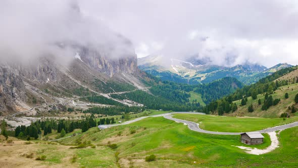 4K Timelapse of Sassolungo mountain and Gardena Pass in summer, South Tyrol, Italy alt