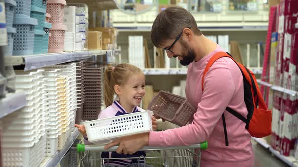 Father and Girl in Shopping Cart Fun Choose Basket in Supermarket