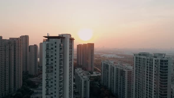 Aerial Drone Shot Over Residential Apartment Buildings on Sunset. Aerial Shot Over Community alt