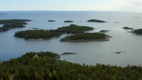 Aerial, tilt up, drone shot, overlooking the archipelago of Porvoo, on the Gulf of Finland, bright, alt