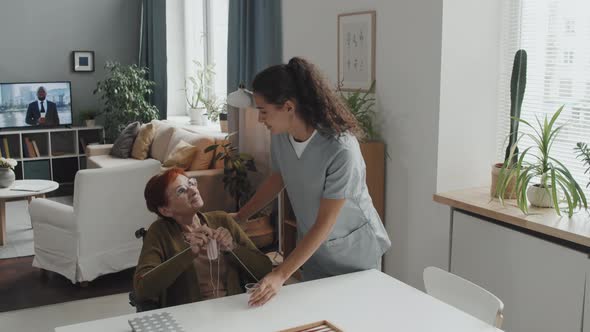 Nurse Taking Care of Senior Woman at Nursing Home alt