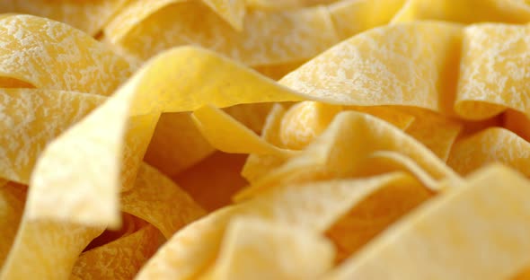 Pappardelle Pasta Dry Slowly Rotates.  alt