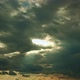 The Sunbeams Break Through Dense Gray Cumulus Moving Clouds Time Lapse - VideoHive Item for Sale