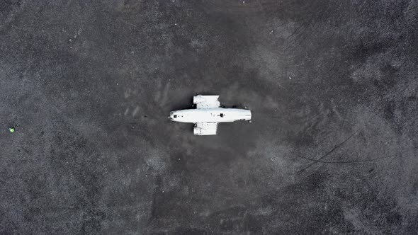 Aerial of an Abandoned Crashed Plane Wreckage on Solheimasandur Beach Iceland alt