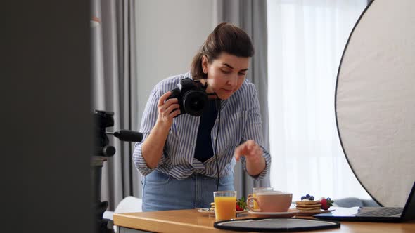 Food Photographer with Camera Working in Kitchen alt
