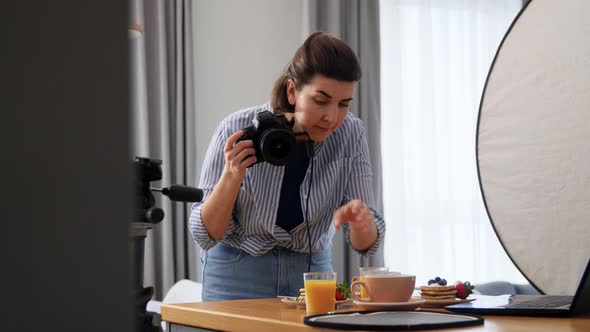 Food Photographer with Camera Working in Kitchen