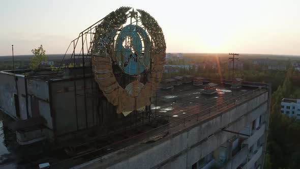 Drone Shot of Emblem on Building's Roof in Pripyat alt