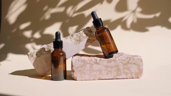 Amber Glass Bottle Standing on Stone alt