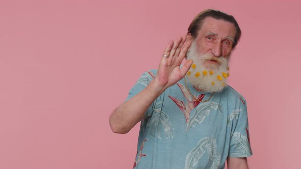 Senior Man Smiling Friendly at Camera and Waving Hands Gesturing Hello or Goodbye Welcoming alt