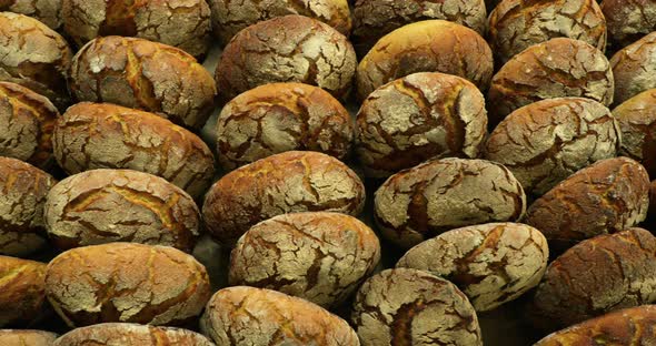 Sourdough Bread Buns Being Sold In A Bakery Shop - overhead slider shot alt