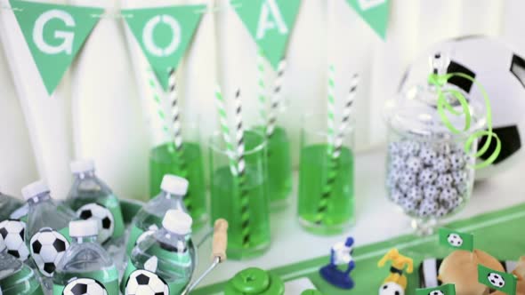 Kids football party set with snacks and drinks. alt