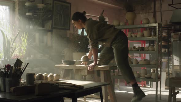 Woman Is Sitting On Potter's Wheel alt