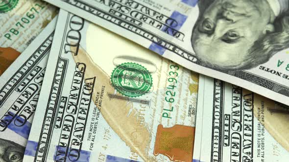 Background of the New US Hundred 100 Dollar Bills Spinning New 100 Dollars Banknote alt