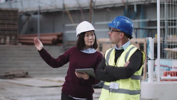 Construction workers looking at project development