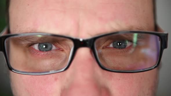 Eyes of a Man in Glasses Closeup