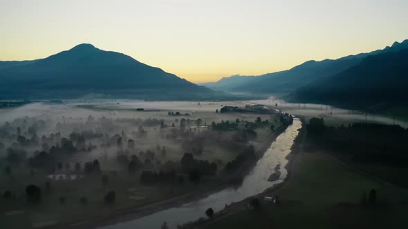 Drone Over Ethereal Misty Landscape Of Zell Am See And Lake alt