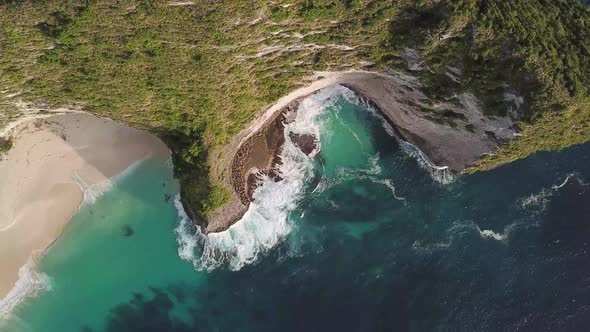 Aerial overhead view of Kelingking Beach in Nusa Penida, Bali, Indonesia. alt