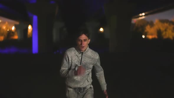 Fugitive Man Escaping From Police Paddy Van with Flashing Lights Under Bridge alt