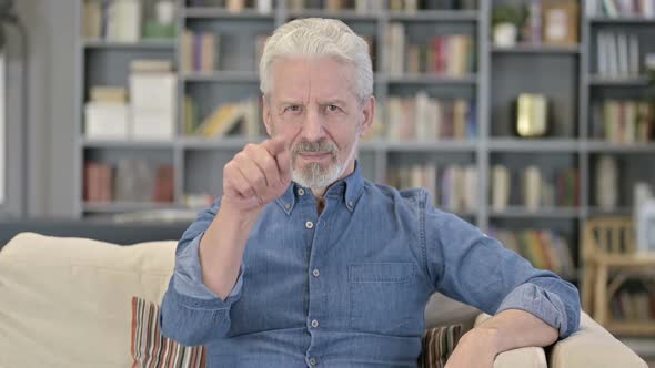 Inviting Old Man Pointing at Camera alt
