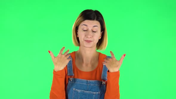 Young Tired Woman Cooling Herself By Her Hand, Suffering From High Temperature Weather. Green Screen alt