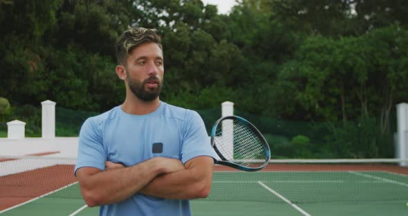 Tennis player crossing arms alt