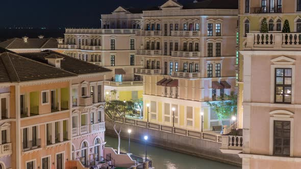 Canal Aerial Top View in Venicelike Qanat Quartier of the Pearl Precinct of Doha Night Timelapse alt