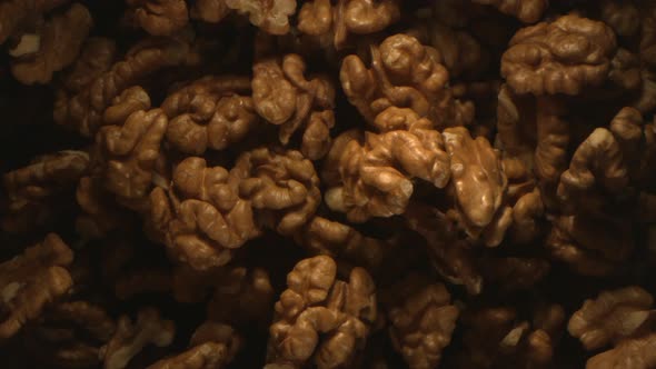 Walnut Nuts Thrown In The Air In High Speed Flying On Black Background 4k alt
