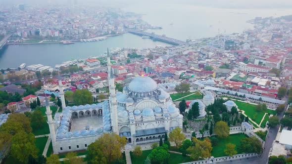 Aerial footage of Suleymaniye Mosque from a foggy day alt