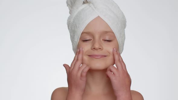 Pretty Young Child Girl Applying Cleansing Moisturizing Face Cream Skincare Natural Creme Cosmetics alt