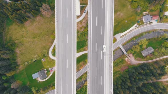 Aerial Top View of Highway Viaduct with Multilane Traffic in Mountains. Autobahn in Austria alt