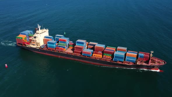 Aerial view of cargo ship in float in sea alt