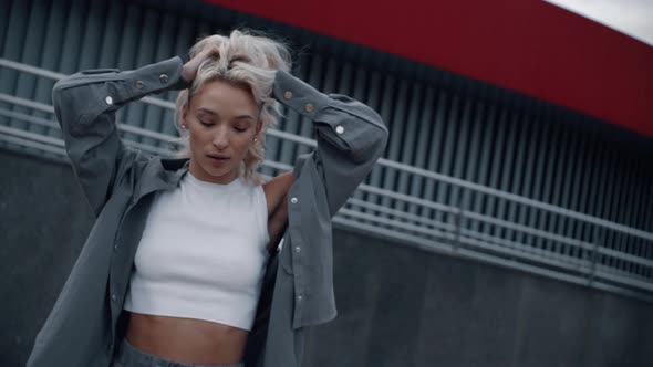 Girl Model Looking Camera in Urban Fashion Near Modern Building in City alt