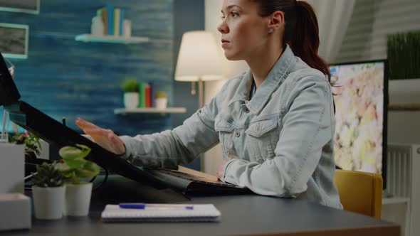 Professional Artist Using Touch Screen Monitor to Edit Pictures alt