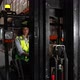 Woman Forklift Driver Riding Around Storehouse - VideoHive Item for Sale