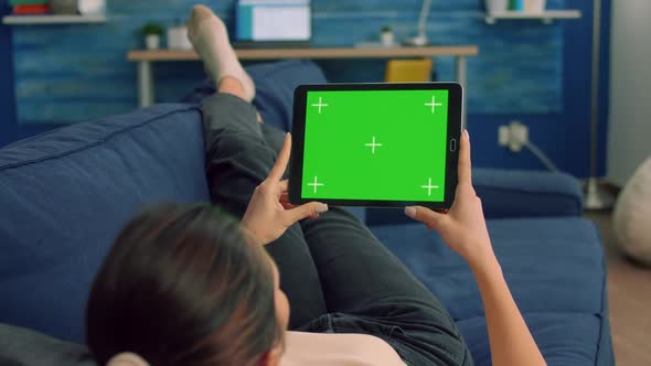 View of Shoulder of Woman Uses Isolated Tablet Computer alt