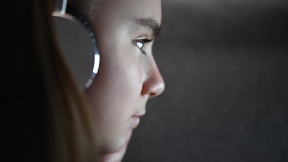 Girl with Headphones Listening Music alt